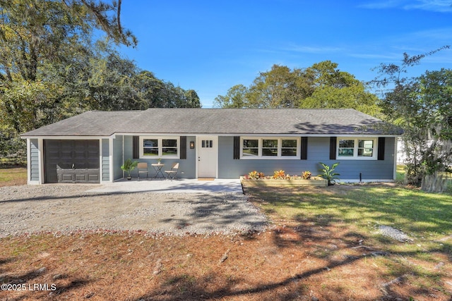 3001 N St, Beaufort, SC 29902 - ranch-style house featuring a garage, dirt driveway, roof with shingles, and a front lawn