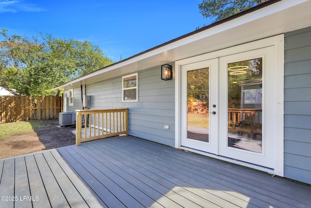 3001 N St, Beaufort, SC 29902 - wooden terrace with central AC unit, fence, and french doors