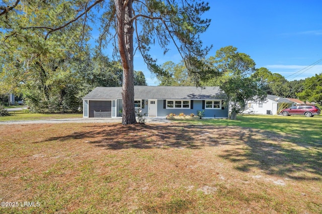 3001 N St, Beaufort, SC 29902 - ranch-style house with dirt driveway, a front lawn, and a garage