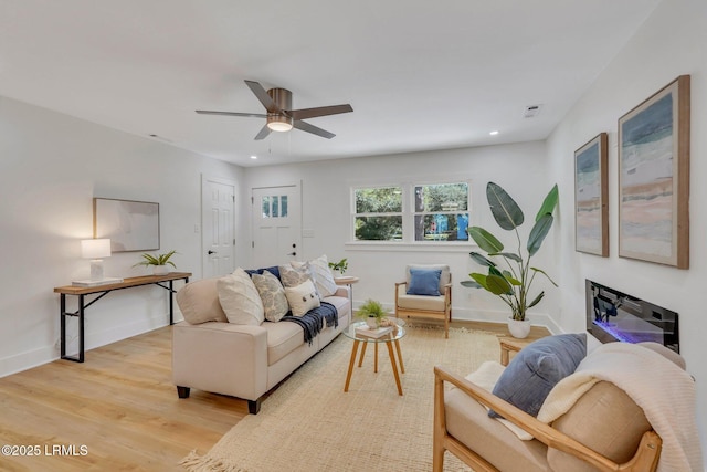 3001 N St, Beaufort, SC 29902 - living room with light wood finished floors, ceiling fan, baseboards, and recessed lighting
