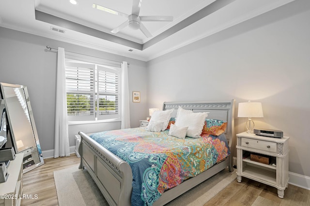 327 River Oak Way, Hardeeville, SC 29927 - bedroom featuring ornamental molding, a tray ceiling, light wood-style flooring, ceiling fan, and recessed lighting