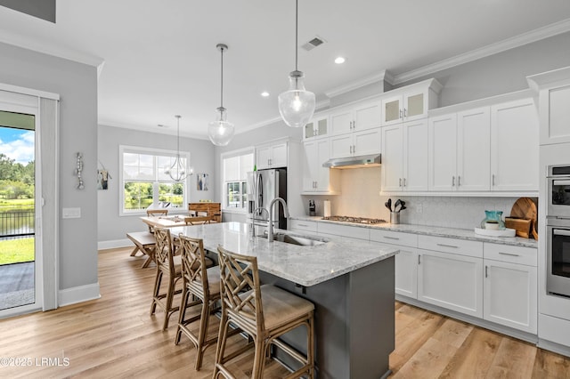 327 River Oak Way, Hardeeville, SC 29927 - kitchen with appliances with stainless steel finishes, ornamental molding, recessed lighting, backsplash, and a kitchen bar