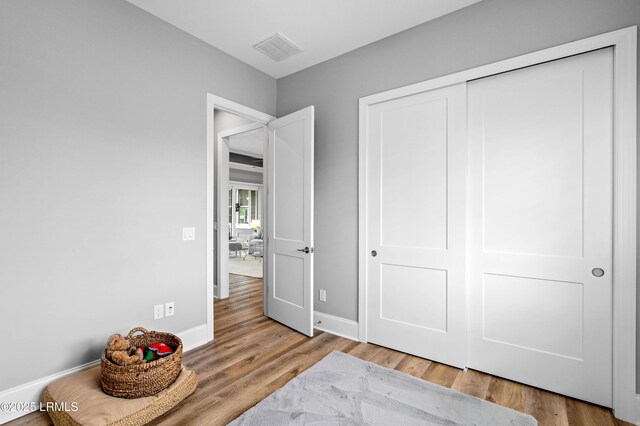 327 River Oak Way, Hardeeville, SC 29927 - bedroom featuring wood finished floors and a closet