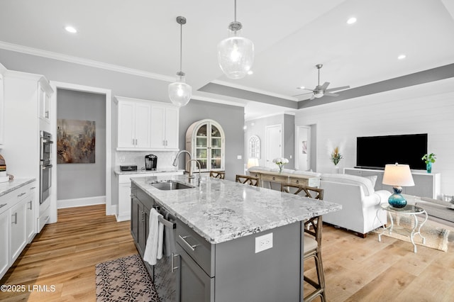 327 River Oak Way, Hardeeville, SC 29927 - kitchen featuring open floor plan, white cabinetry, a breakfast bar, light wood-style floors, and ceiling fan