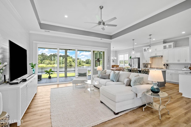 327 River Oak Way, Hardeeville, SC 29927 - living room with ceiling fan, crown molding, light wood-type flooring, a raised ceiling, and recessed lighting
