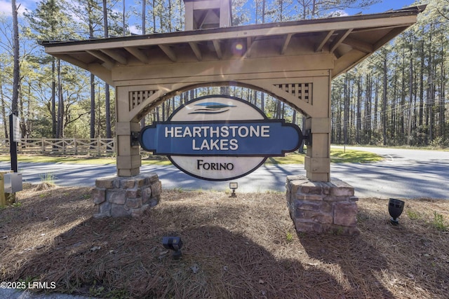 community sign with fence