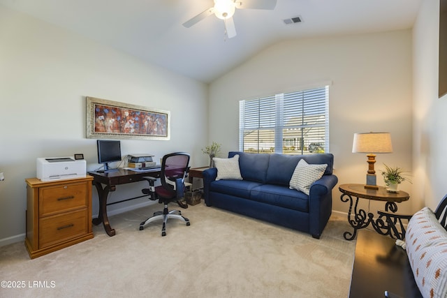 office featuring visible vents, lofted ceiling, baseboards, light colored carpet, and a ceiling fan