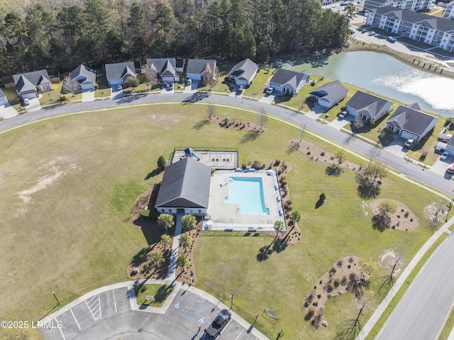 birds eye view of property with a water view