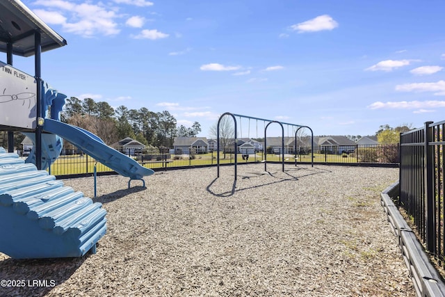 community jungle gym with fence and a residential view