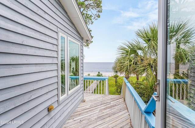 balcony featuring a deck with water view