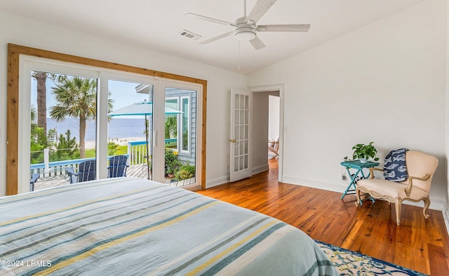 bedroom featuring multiple windows, access to exterior, light hardwood / wood-style flooring, and ceiling fan