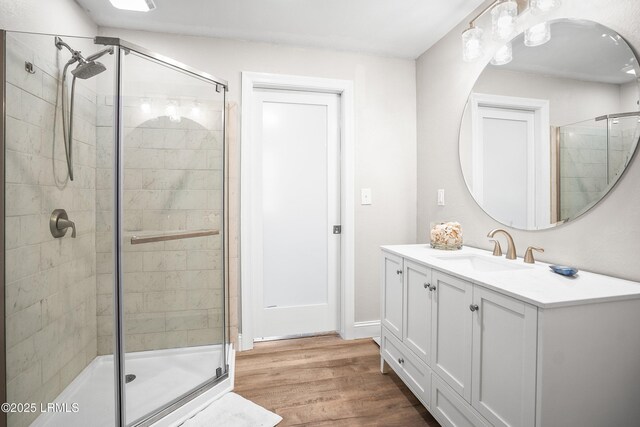1 Scallop Ct, Harbor Island, SC 29920 - bathroom featuring a stall shower, wood finished floors, and vanity