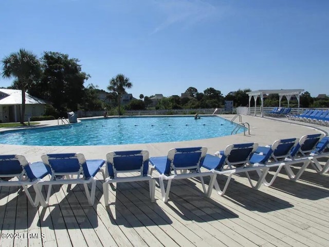 1 Scallop Ct, Harbor Island, SC 29920 - community pool with a pergola and a wooden deck
