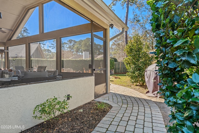 view of patio / terrace featuring a sunroom