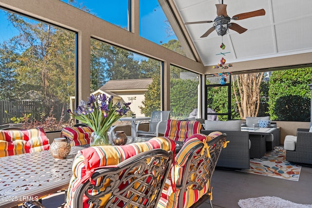 sunroom featuring ceiling fan and vaulted ceiling