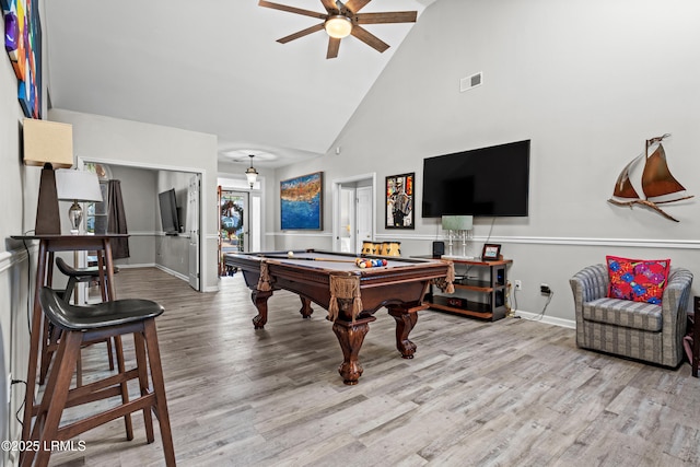 rec room with billiards, high vaulted ceiling, ceiling fan, and light wood-type flooring