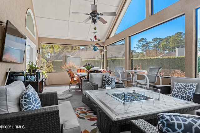 sunroom / solarium featuring vaulted ceiling and ceiling fan