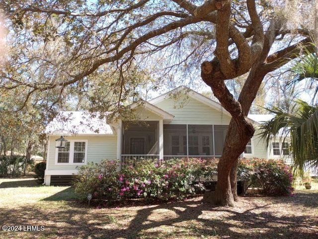 view of front of property featuring a sunroom