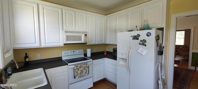 45 Holbrook Dr, Beaufort, SC 29902 - kitchen featuring white appliances, dark countertops, white cabinetry, and dark wood-style floors