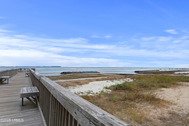 exterior space featuring a view of the beach and a water view