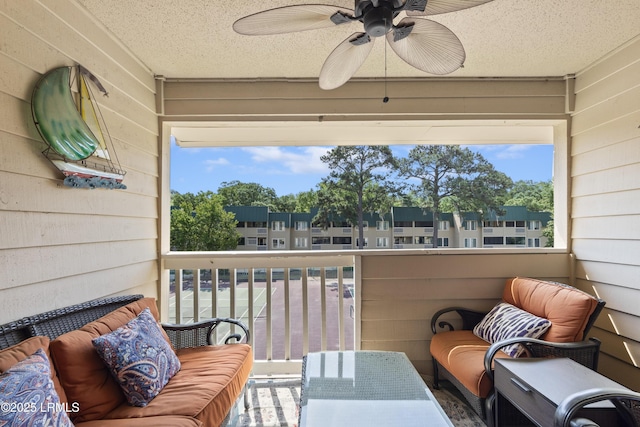 balcony featuring an outdoor hangout area and ceiling fan