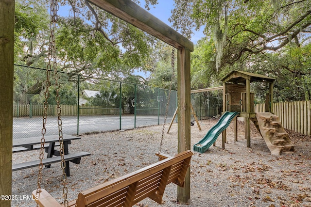 view of playground with tennis court