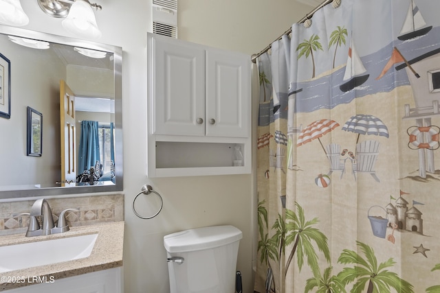 bathroom featuring vanity, ornamental molding, backsplash, and toilet