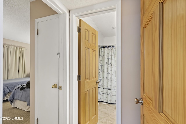 corridor with a textured ceiling