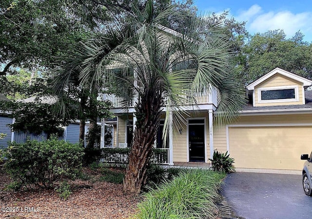 144 Locust Fence Rd, Saint Helena Island, SC 29920 - obstructed view of property with aphalt driveway and a garage