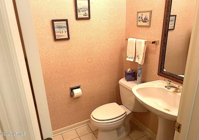 144 Locust Fence Rd, Saint Helena Island, SC 29920 - half bath featuring wallpapered walls, tile patterned floors, toilet, and baseboards