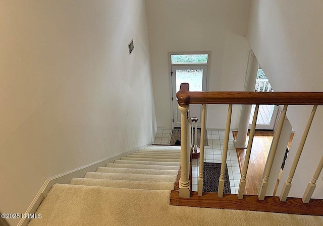 144 Locust Fence Rd, Saint Helena Island, SC 29920 - staircase with baseboards, visible vents, and a towering ceiling
