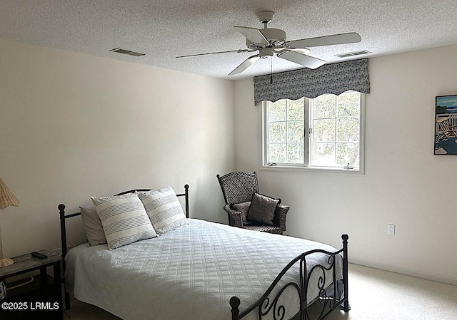 144 Locust Fence Rd, Saint Helena Island, SC 29920 - bedroom with a ceiling fan, light colored carpet, visible vents, and a textured ceiling
