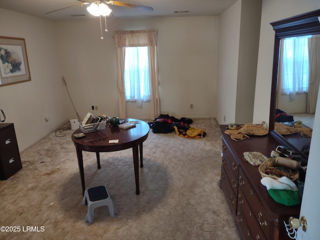 misc room featuring ceiling fan and light colored carpet