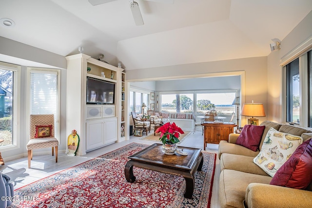 living room with vaulted ceiling and ceiling fan