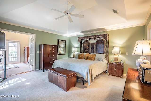 bedroom featuring light colored carpet, access to exterior, ceiling fan, a raised ceiling, and crown molding