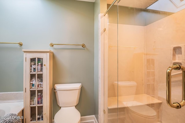 bathroom with an enclosed shower and toilet