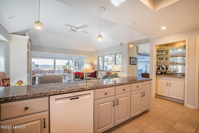 kitchen featuring stone counters, dishwasher, hanging light fixtures, and lofted ceiling