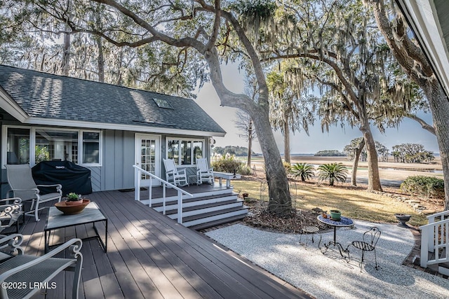 wooden terrace with area for grilling