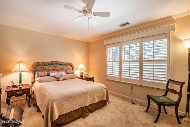 carpeted bedroom featuring ornamental molding and ceiling fan