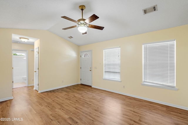 16 Star Magnolia Ct, Beaufort, SC 29907 - spare room with light wood-type flooring, lofted ceiling, a ceiling fan, and baseboards