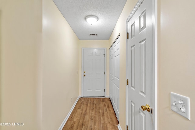 16 Star Magnolia Ct, Beaufort, SC 29907 - corridor featuring baseboards, a textured ceiling, and light wood-style floors