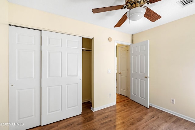 16 Star Magnolia Ct, Beaufort, SC 29907 - unfurnished bedroom featuring a closet, wood finished floors, baseboards, and ceiling fan