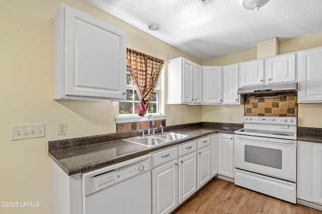 16 Star Magnolia Ct, Beaufort, SC 29907 - kitchen featuring white appliances, a sink, under cabinet range hood, dark countertops, and white cabinets