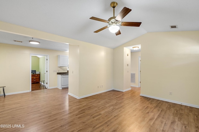 16 Star Magnolia Ct, Beaufort, SC 29907 - spare room with a ceiling fan, light wood-style flooring, vaulted ceiling, and baseboards