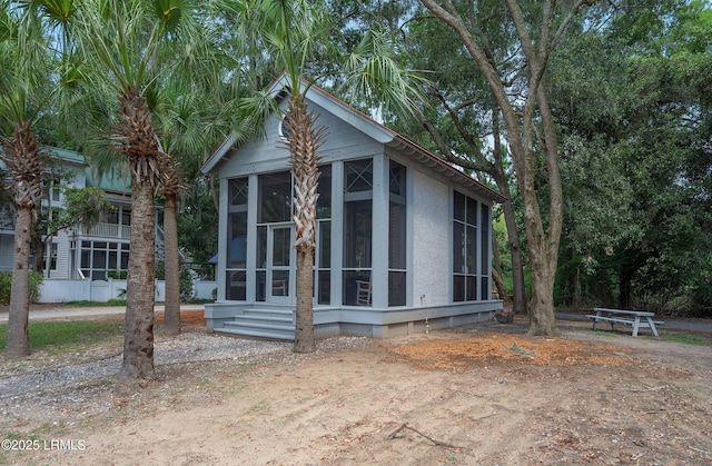 105 Bartram Dr, Beaufort, SC 29902 - view of side of home with a sunroom and stucco siding