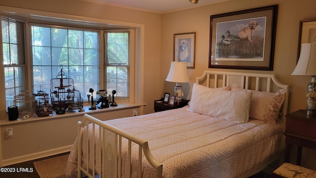 bedroom with crown molding