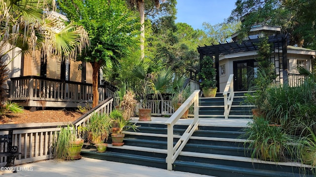 wooden deck featuring a pergola