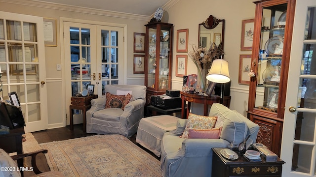 sitting room with french doors, dark hardwood / wood-style floors, and crown molding