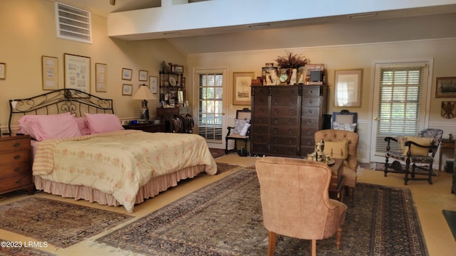 bedroom featuring lofted ceiling and carpet