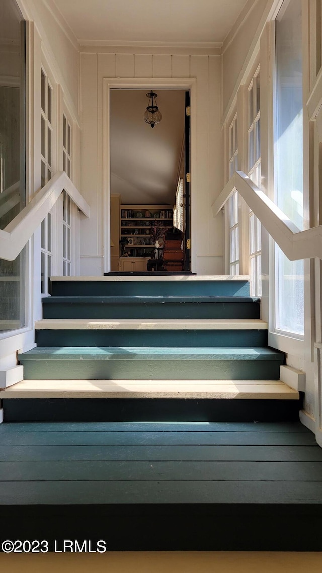 staircase with crown molding